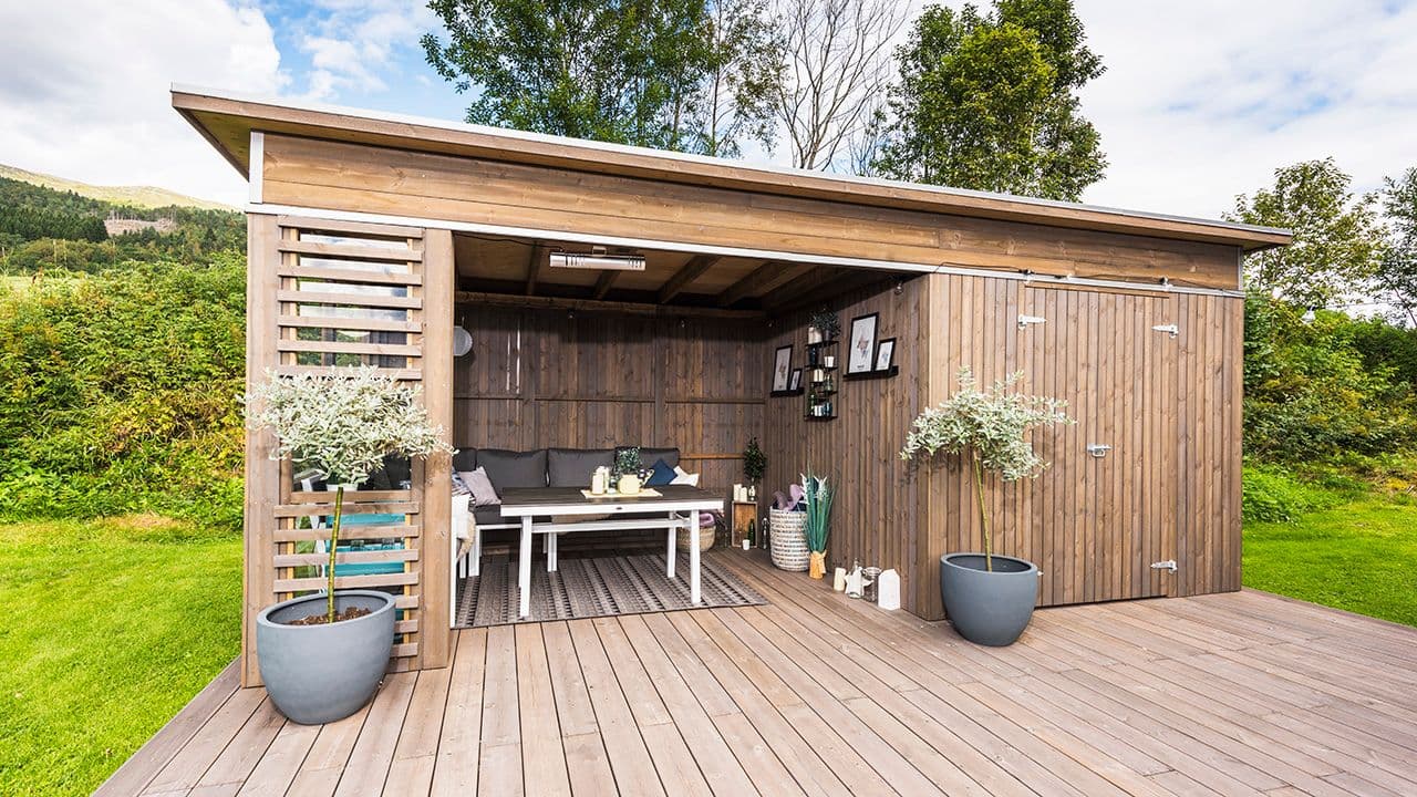 Hagestue byggesett med utebod.